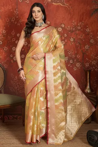 Gold tissue woven design saree with unstitched blouse piece.