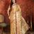 Gold tissue woven design saree with unstitched blouse piece.