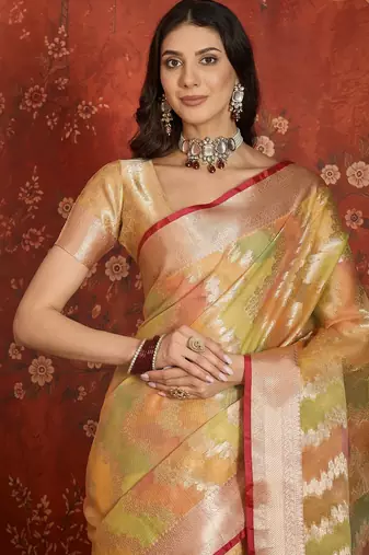 Gold tissue woven design saree with unstitched blouse piece.