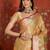 Gold tissue woven design saree with unstitched blouse piece.
