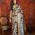 Black silk cotton printed saree with unstitched blouse piece.