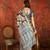 Black silk cotton printed saree with unstitched blouse piece.
