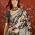 Black silk cotton printed saree with unstitched blouse piece.