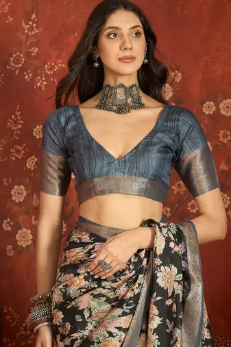 Black silk cotton printed saree with unstitched blouse piece.