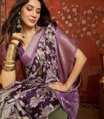 Purple silk cotton printed saree with unstitched blouse piece.