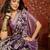 Purple silk cotton printed saree with unstitched blouse piece.