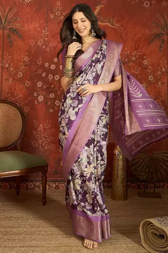 Purple silk cotton printed saree with unstitched blouse piece.
