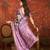 Purple silk cotton printed saree with unstitched blouse piece.