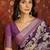 Purple silk cotton printed saree with unstitched blouse piece.