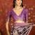 Purple silk cotton printed saree with unstitched blouse piece.