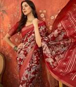 Red silk cotton printed saree with unstitched blouse piece.