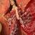 Red silk cotton printed saree with unstitched blouse piece.