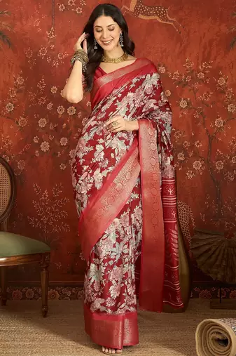 Red silk cotton printed saree with unstitched blouse piece.