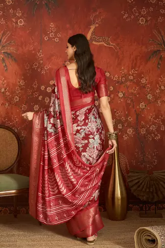 Red silk cotton printed saree with unstitched blouse piece.