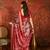 Red silk cotton printed saree with unstitched blouse piece.