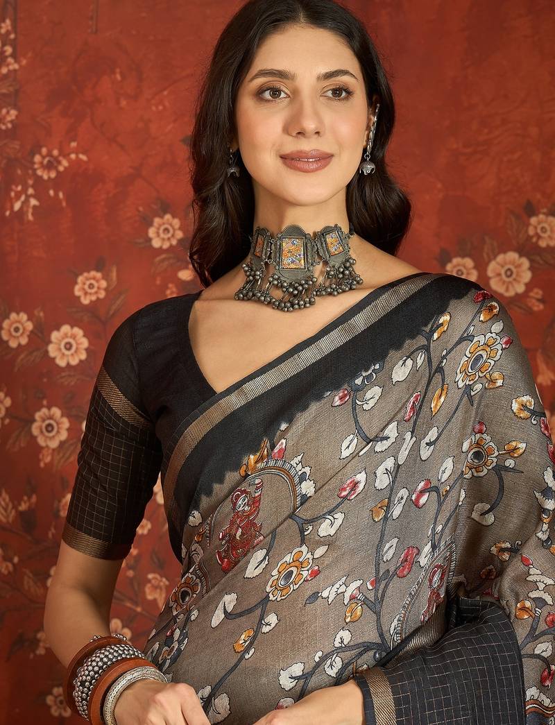Grey silk cotton printed saree with unstitched blouse piece.
