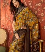 Mustard silk cotton printed saree with unstitched blouse piece.