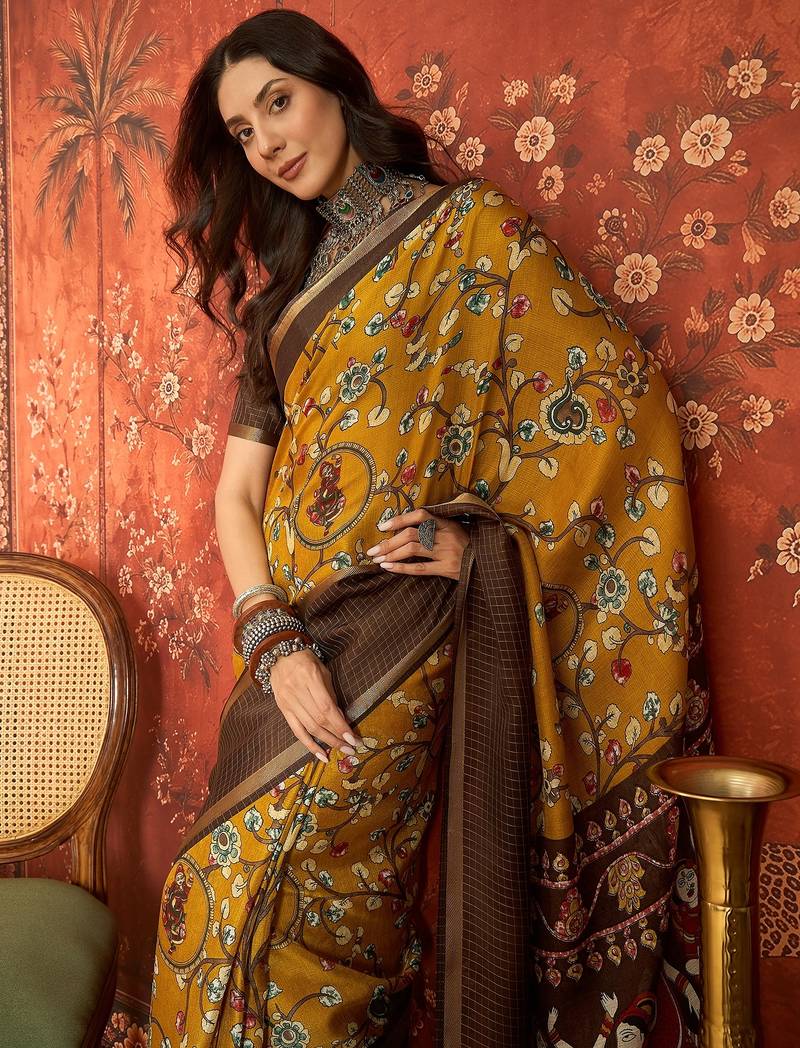 Mustard silk cotton printed saree with unstitched blouse piece.