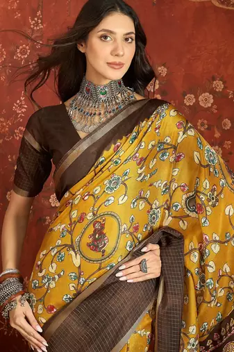 Mustard silk cotton printed saree with unstitched blouse piece.
