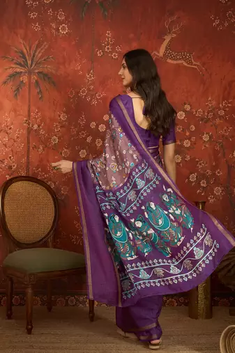 Purple silk cotton printed saree with unstitched blouse piece.