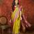 Green silk cotton printed saree with unstitched blouse piece.