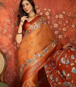 Orange silk cotton printed saree with unstitched blouse piece.