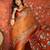 Orange silk cotton printed saree with unstitched blouse piece.