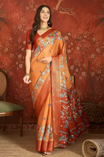 Orange silk cotton printed saree with unstitched blouse piece.