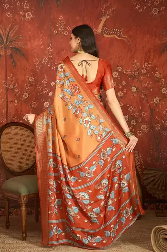 Orange silk cotton printed saree with unstitched blouse piece.
