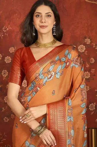Orange silk cotton printed saree with unstitched blouse piece.