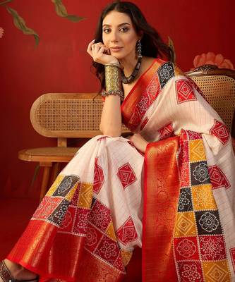 Cream silk cotton bandhni saree with unstitched blouse piece. 1