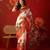 Cream silk cotton bandhni saree with unstitched blouse piece.