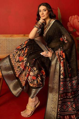 Black chiffon printed saree with unstitched blouse piece.
