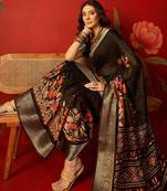 Black chiffon printed saree with unstitched blouse piece.
