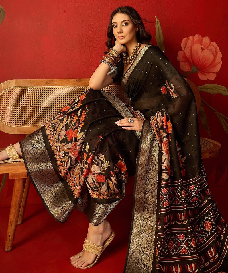 Black chiffon printed saree with unstitched blouse piece.