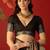 Black chiffon printed saree with unstitched blouse piece.