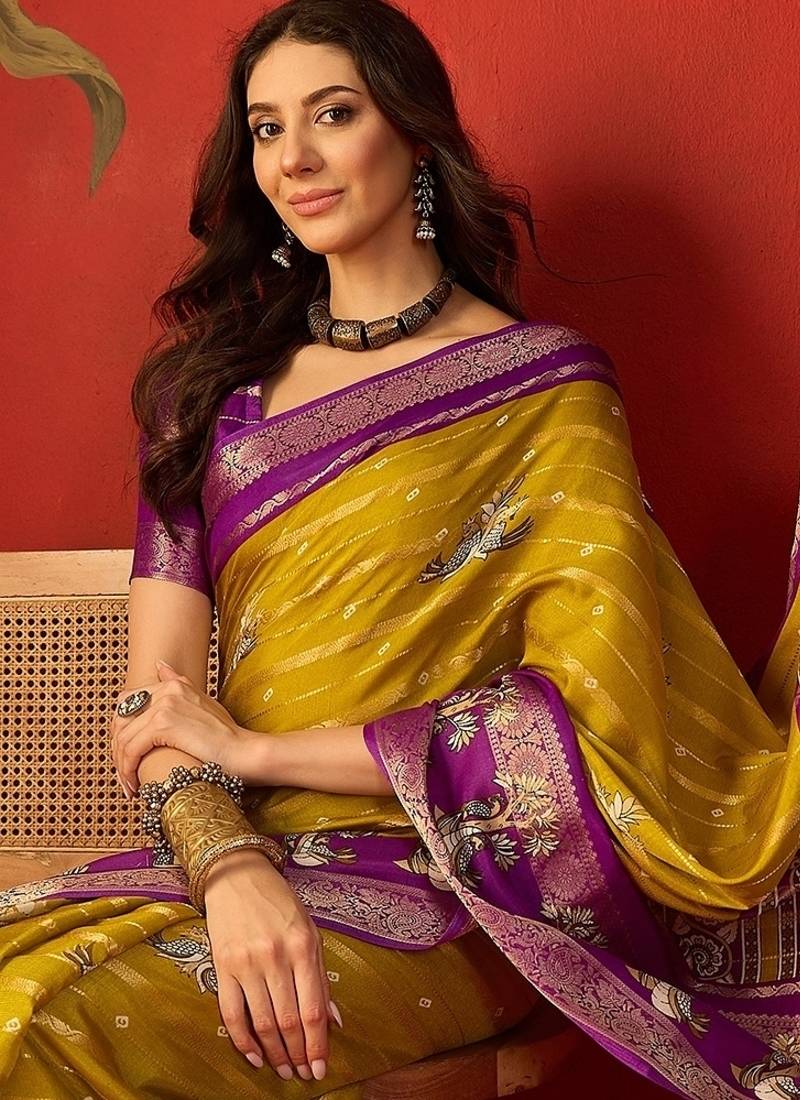 Mehndi silk cotton printed saree with unstitched blouse piece.
