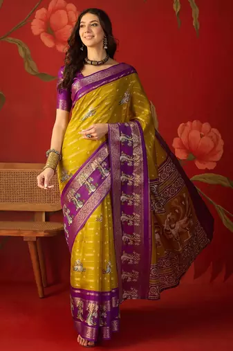 Mehndi silk cotton printed saree with unstitched blouse piece.
