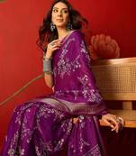Purple silk cotton printed saree with unstitched blouse piece.