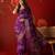 Purple silk cotton printed saree with unstitched blouse piece.
