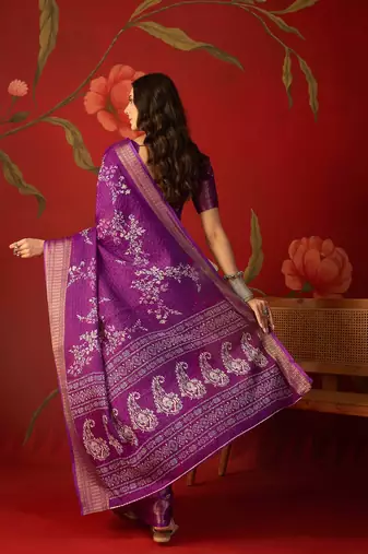 Purple silk cotton printed saree with unstitched blouse piece.