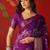 Purple silk cotton printed saree with unstitched blouse piece.