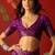 Purple silk cotton printed saree with unstitched blouse piece.
