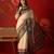 Cream silk cotton printed saree with unstitched blouse piece.