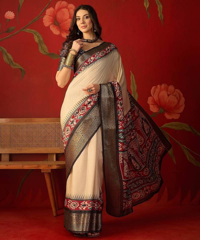 Cream silk cotton printed saree with unstitched blouse piece.