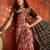 Red silk cotton printed saree with unstitched blouse piece.
