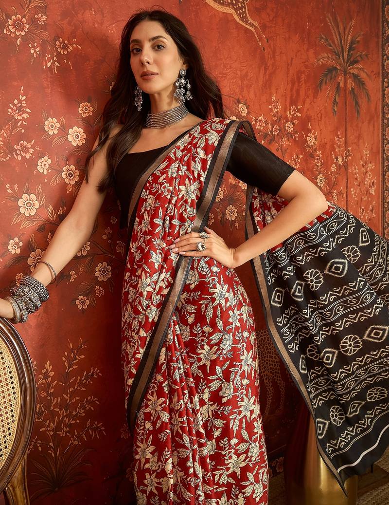 Red silk cotton printed saree with unstitched blouse piece.