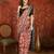 Red silk cotton printed saree with unstitched blouse piece.