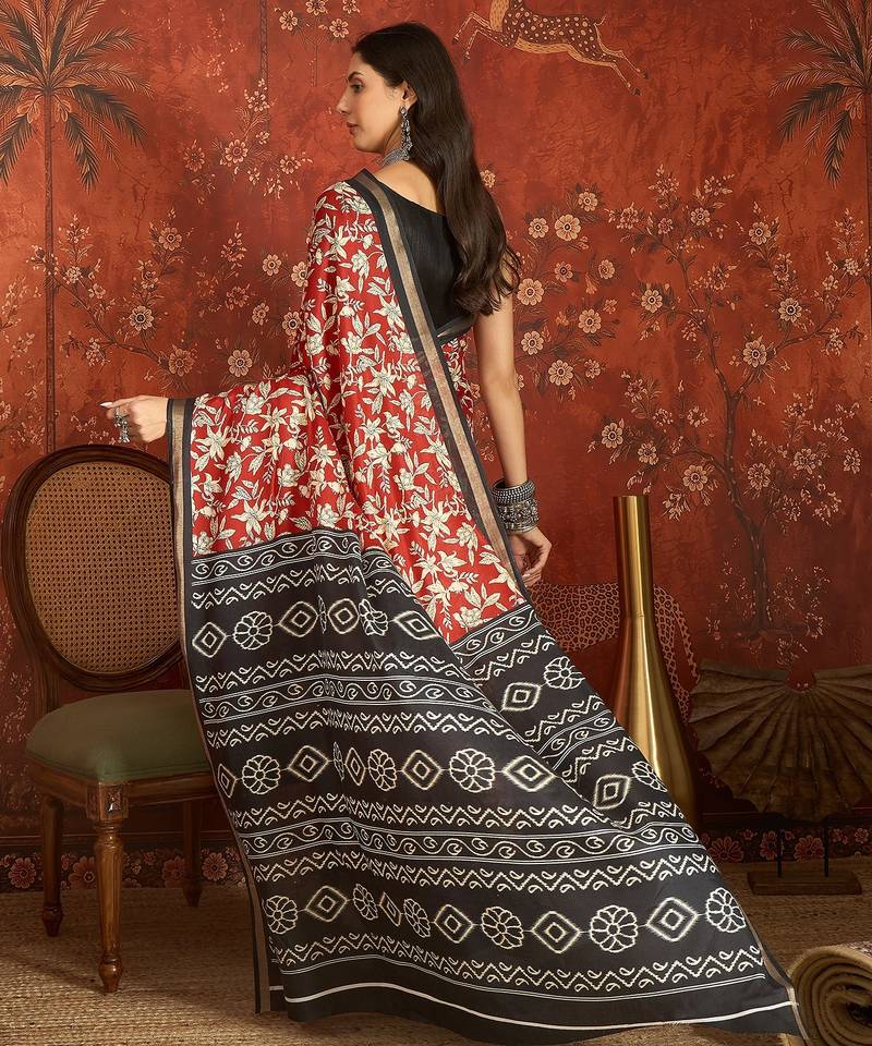 Red silk cotton printed saree with unstitched blouse piece.