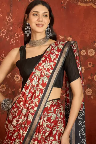 Red silk cotton printed saree with unstitched blouse piece.